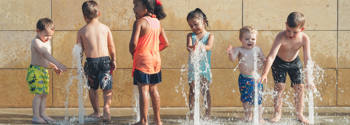 Children Playing at a Water Fountain